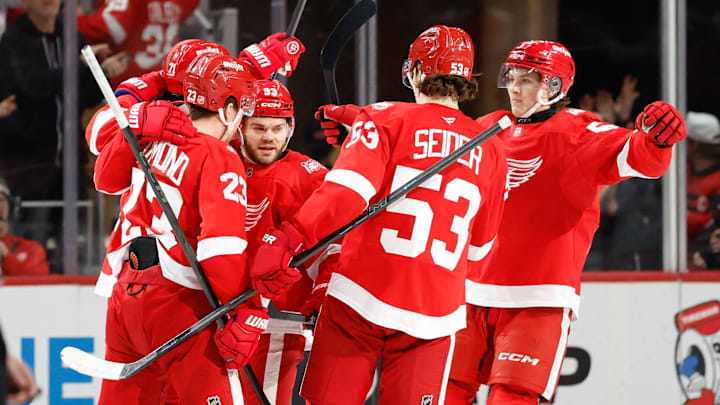 Mar 24, 2026; Detroit, Michigan, USA;  Detroit Red Wings center Dylan Larkin (71) receives congratulations from teammates after scoring in the third period against the Ottawa Senators at Little Caesars Arena. Mandatory Credit: Rick Osentoski-Imagn Images