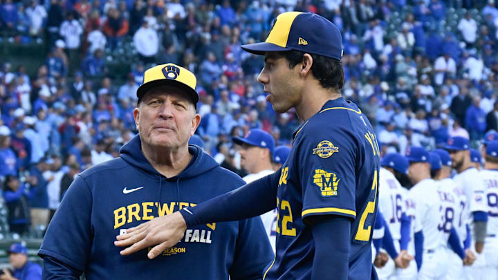 Oct 8, 2025; Chicago, Illinois, USA; Milwaukee Brewers designated hitter Christian Yelich (22) greets manager Pat Murphy (49) prior to game three of the NLDS round against the Chicago Cubs for the 2025 MLB playoffs at Wrigley Field. Mandatory Credit: Matt Marton-Imagn Images