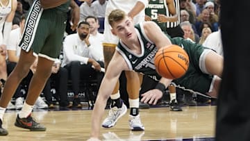 Jan 12, 2025; Evanston, Illinois, USA; Michigan State Spartans center Carson Cooper (15) is fouled against the Northwestern Wildcats during the first half at Welsh-Ryan Arena. Mandatory Credit: David Banks-Imagn Images