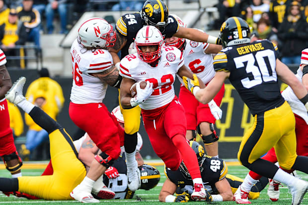 Nebraska Cornhuskers running back Devine Ozigbo (22) is pursued by Iowa Hawkeyes defensive back Jake Gervase (30).