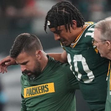 Sep 6, 2024; Sao Paulo, BRA; Green Bay Packers quarterback Jordan Love (10) is assisted off the field after an injury during the second half against the Philadelphia Eagles at Neo Quimica Arena.