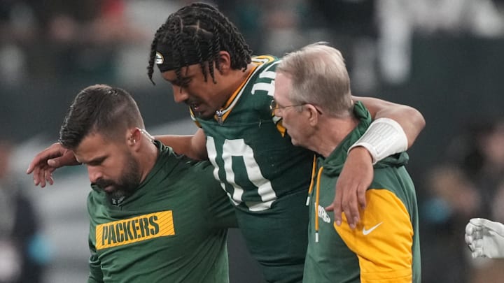 Sep 6, 2024; Sao Paulo, BRA; Green Bay Packers quarterback Jordan Love (10) is assisted off the field after an injury during the second half against the Philadelphia Eagles at Neo Quimica Arena.