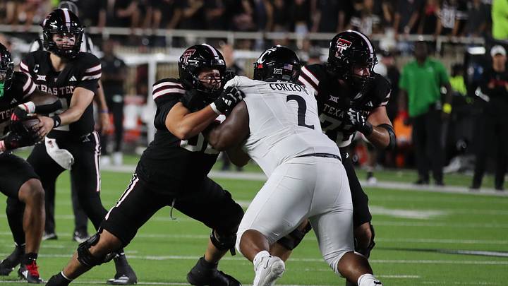 Sep 28, 2024; Lubbock, Texas, USA;  Texas Tech Red Raiders offensive lineman Davion Carter (56) blocks Cincinnati Bearcats defensive tackle Dontay Corleone (2) in the first half at Jones AT&T Stadium and Cody Campbell Field. Mandatory Credit: Michael C. Johnson-Imagn Images