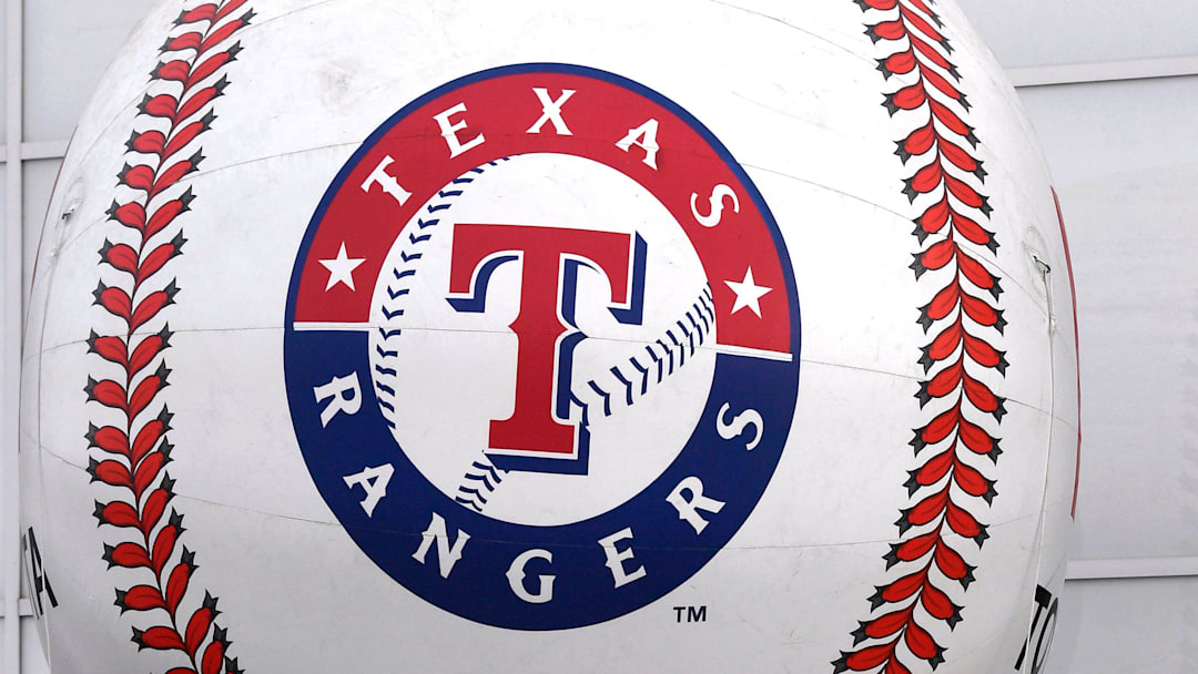 The Texas Rangers logo on a baseball. 