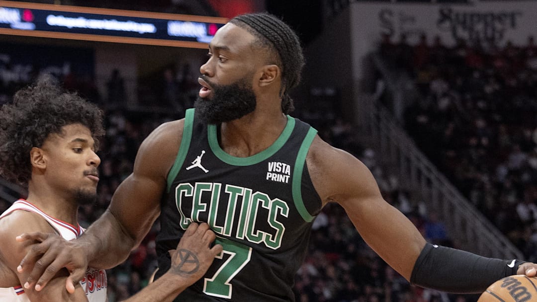 Jan 21, 2024; Houston, Texas, USA;  Boston Celtics guard Jaylen Brown (7) dribbles against Houston Rockets guard Jalen Green (4) in the second half at Toyota Center. Mandatory Credit: Thomas Shea-Imagn Images
