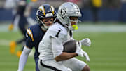 Nov 30, 2025; Inglewood, California, USA; Las Vegas Raiders wide receiver Tre Tucker (1) makes a catch against the Los Angeles Chargers during the first half at SoFi Stadium. Mandatory Credit: Jayne Kamin-Oncea-Imagn Images