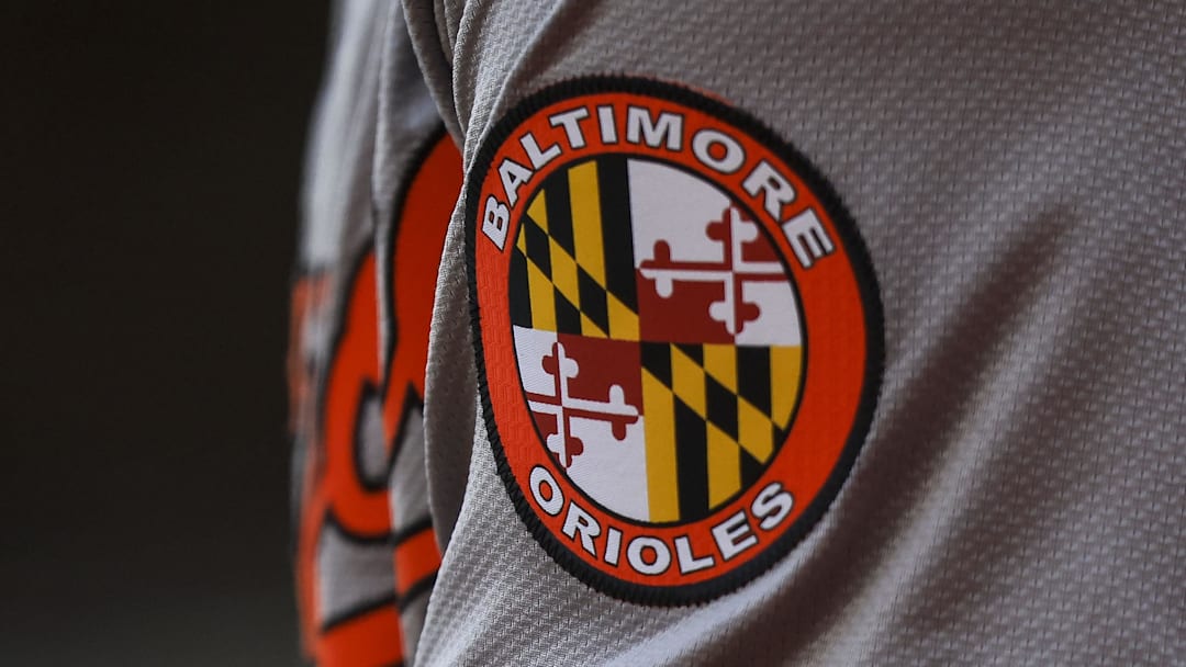 May 5, 2024; Cincinnati, Ohio, USA; The Baltimore Orioles logo on the sleeve of designated hitter Gunnar Henderson (2) as he prepares on deck during the seventh inning against the Cincinnati Reds at Great American Ball Park. Mandatory Credit: Katie Stratman-Imagn Images