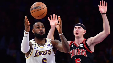 Mar 26, 2023; Los Angeles, California, USA; dLos Angeles Lakers forward LeBron James (6) plays for the ball against Chicago Bulls guard Alex Caruso (6) uring the first half at Crypto.com Arena. Mandatory Credit: Gary A. Vasquez-USA TODAY Sports