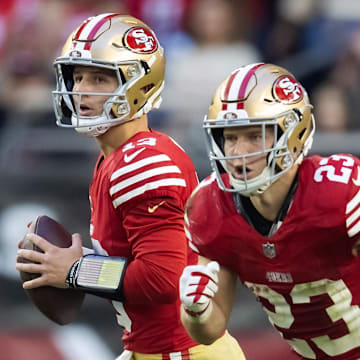 Dec 17, 2023; Glendale, Arizona, USA; San Francisco 49ers quarterback Brock Purdy (13) and running back Christian McCaffrey (23) against the Arizona Cardinals at State Farm Stadium. Mandatory Credit: Mark J. Rebilas-Imagn Images