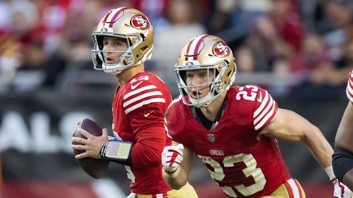 Dec 17, 2023; Glendale, Arizona, USA; San Francisco 49ers quarterback Brock Purdy (13) and running back Christian McCaffrey (23) against the Arizona Cardinals at State Farm Stadium. Mandatory Credit: Mark J. Rebilas-Imagn Images