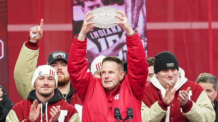 Indiana Hoosiers head coach Curt Cignetti holds up the coaches trophy on Saturday, Jan. 24, 2026, during the Indiana Football College Football Playoff National Championship celebration and parade at Memorial Stadium in Bloomington.
