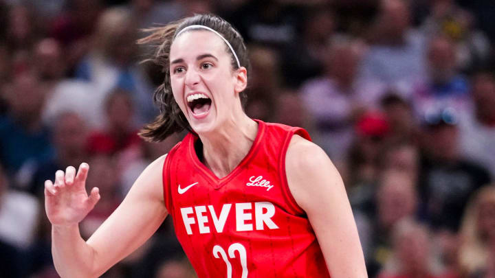 Indiana Fever guard Caitlin Clark (22) reacts after shooting a 3-pointer Friday, Aug. 16, 2024, during the game at Gainbridge Fieldhouse in Indianapolis.