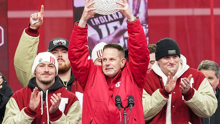 Indiana Hoosiers head coach Curt Cignetti holds up the coaches trophy on Saturday, Jan. 24, 2026, during the Indiana Football College Football Playoff National Championship celebration and parade at Memorial Stadium in Bloomington.