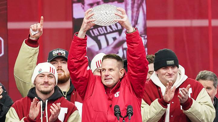 Jan 24, 2026; Bloomington, IN, USA; Indiana Hoosiers head coach Curt Cignetti holds up the coaches trophy on Saturday, Jan. 24, 2026, during the Indiana Football College Football Playoff National Championship celebration and parade at Memorial Stadium. Mandatory Credit: Grace Hollars-USA TODAY Network via Imagn Images