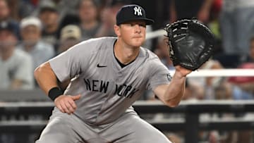 Aug 27, 2024; Washington, District of Columbia, USA; New York Yankees third baseman DJ LeMahieu (26) fields the ball at first base against the Washington Nationals during the sixth inning at Nationals Park