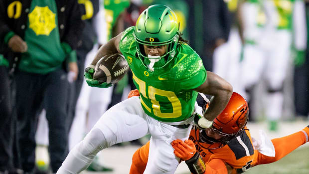 Oregon Ducks running back Jordan James on a rushing attempt during a college football game.