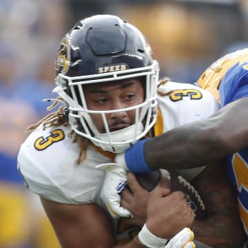 Aug 31, 2024; Pittsburgh, Pennsylvania, USA;  Kent State Golden Flashes running back Ky Thomas (3) runs the ball against Pittsburgh Panthers linebacker Rasheem Biles (31) during the third quarter at Acrisure Stadium. Pittsburgh won 55-24. Mandatory Credit: Charles LeClaire-USA TODAY Sports