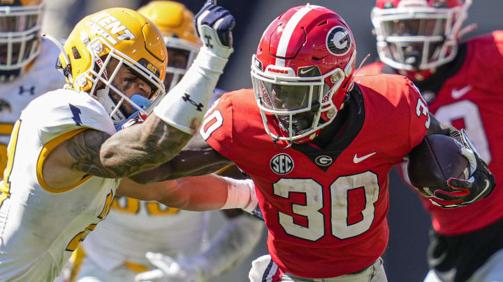 Sep 24, 2022; Athens, Georgia, USA; Georgia Bulldogs running back Daijun Edwards (30) runs against Kent State Golden Flashes safety Nico Bolden (24) during the second half at Sanford Stadium. Mandatory Credit: Dale Zanine-USA TODAY Sports