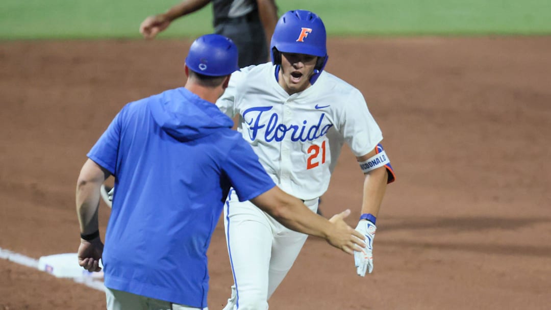 Florida utility Caden McDonald (21) celebrates his home run against Texas A&M during an NCAA baseball game at Condron Family Ballpark at Alfred A. McKethan Field in Gainesville, FL on Friday, April 24, 2026. [Alan Youngblood/Gainesville Sun]