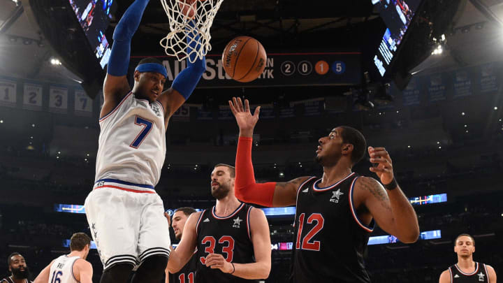 February 15, 2015; New York, NY, USA; Eastern Conference forward Carmelo Anthony of the New York Knicks (7) dunks against Western Conference center Marc Gasol of the Memphis Grizzlies (33) and forward LaMarcus Aldridge of the Portland Trail Blazers (12) during the second half of the 2015 NBA All-Star Game at Madison Square Garden. The West defeated the East 163-158. Mandatory Credit: Bob Donnan-USA TODAY Sports