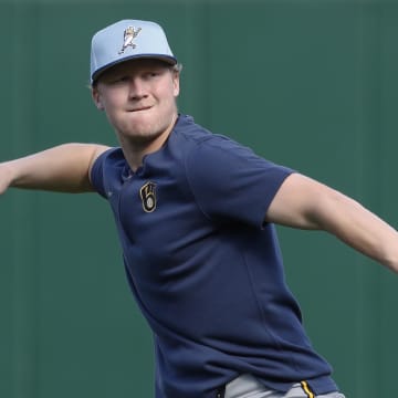 Apr 22, 2024; Pittsburgh, Pennsylvania, USA;  Milwaukee Brewers outfielder Joey Wiemer (28) warms up before a game against the Pittsburgh Pirates at PNC Park. Mandatory Credit: Charles LeClaire-USA TODAY Sports