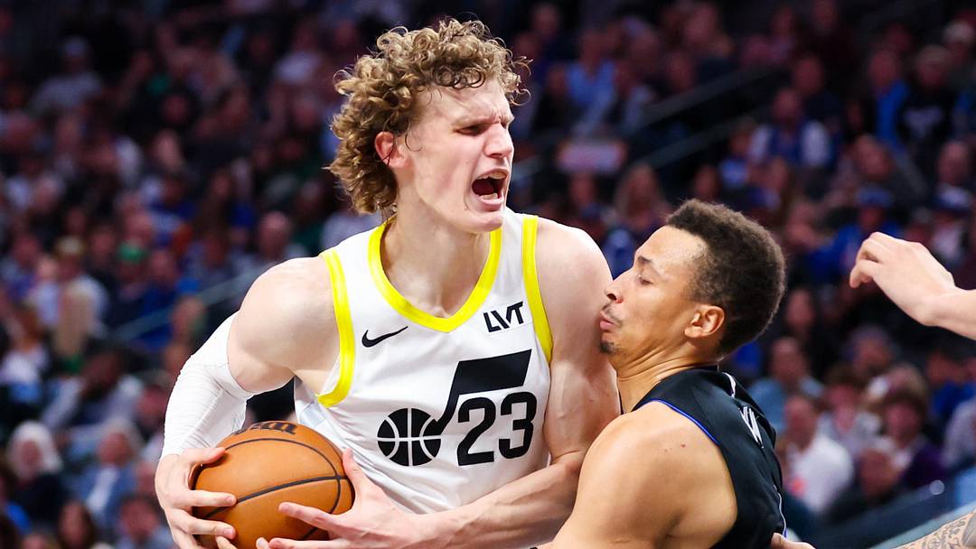 Mar 21, 2024; Dallas, Texas, USA;  Utah Jazz forward Lauri Markkanen (23) drives to the basket as Dallas Mavericks guard Dante Exum (0) defends during the second half at American Airlines Center. Mandatory Credit: Kevin Jairaj-Imagn Images