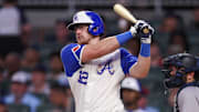 Jul 19, 2025; Atlanta, Georgia, USA; Atlanta Braves catcher Sean Murphy (12) hits a single against the New York Yankees in the fifth inning at Truist Park. Mandatory Credit: Brett Davis-Imagn Images
