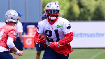 Jun 10, 2024; Foxborough, MA, USA; New England Patriots running back Antonio Gibson (21) runs the ball at minicamp at Gillette Stadium. Mandatory Credit: Eric Canha-USA TODAY Sports