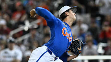 Liam Peterson (12) delivers a pitch against Texas A&M in the 2024 College World Series