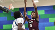 Lebanon forward Anthony Thompson (5) shoots the ball during their during their 50-61 loss to Winton Woods Friday, Jan. 5, 2024.