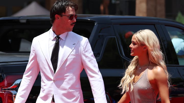 Jul 16, 2024; Arlington, Texas, USA; Pittsburgh Pirates pitcher Paul Skenes walks the red carpet with LSU gymnast and girlfriend Livvy Dunne before the 2024 MLB All-Star game at Globe Life Field. 