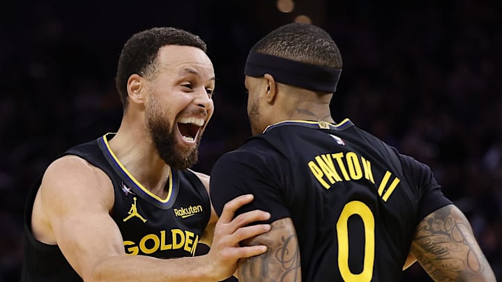 Jan 19, 2026; San Francisco, California, USA; Golden State Warriors guard Stephen Curry (30) celebrates with guard Gary Payton II (0) after Payton scored a basket against the Miami Heat during the third quarter at Chase Center. Mandatory Credit: Kelley L Cox-Imagn Images