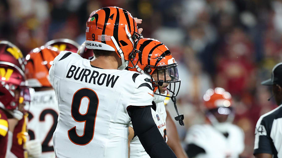 Aug 18, 2025; Landover, Maryland, USA; Cincinnati Bengals running back Chase Brown (30) celebrates with Bengals quarterback Joe Burrow (9) after scoring a touchdown during the first half at Northwest Stadium. Mandatory Credit: Amber Searls-Imagn Images | Amber Searls-Imagn Images