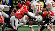 ATLANTA FALCONS: Georgia linebacker Jalon Walker (11) and Georgia defensive lineman Mykel Williams (13) take down Texas quarterback Quinn Ewers (3) during the second half of the SEC championship game against Texas in Atlanta, on Saturday, Dec. 7, 2024.