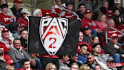 Mar 7, 2024; Pullman, Washington, USA; Washington State Cougars fan holds up a Pac-2 flag during a basketball game against the Washington Huskies in the second half at Friel Court at Beasley Coliseum. Washington Huskies won 74-68. Mandatory Credit: James Snook-Imagn Images