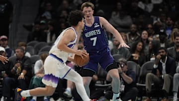 Nov 2, 2025; Charlotte, North Carolina, USA; Utah Jazz guard Walter Clayton Jr. (13) drives to the basket against Charlotte Hornets guard Kon Knueppel (7) during the second quarter at Spectrum Center. Mandatory Credit: Jim Dedmon-Imagn Images