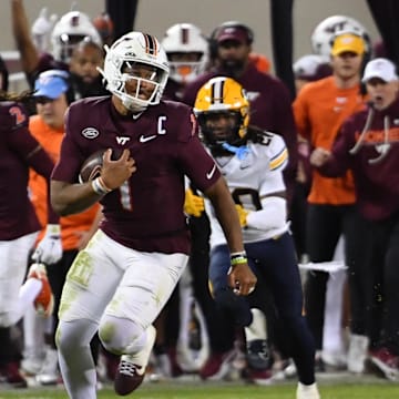 Oct 24, 2025; Blacksburg, Virginia, USA;  Virginia Tech Hokies quarterback Kyron Drones (1) runs the ball against the California Golden Bears during the fourth quarter at Lane Stadium. Mandatory Credit: Brian Bishop-Imagn Images