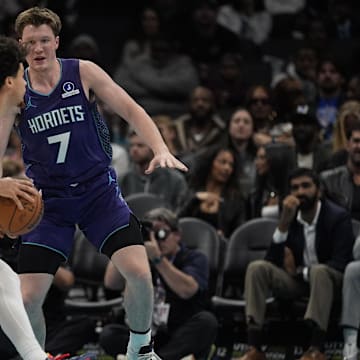 Nov 2, 2025; Charlotte, North Carolina, USA; Utah Jazz guard Walter Clayton Jr. (13) drives to the basket against Charlotte Hornets guard Kon Knueppel (7) during the second quarter at Spectrum Center. Mandatory Credit: Jim Dedmon-Imagn Images