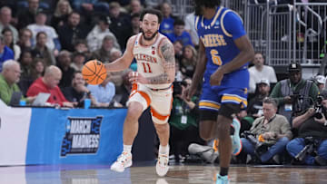 Mar 20, 2025; Providence, RI, USA; Clemson Tigers guard Jaeden Zackery (11) brings the ball up court against McNeese State Cowboys guard Javohn Garcia (6) during the second half at Amica Mutual Pavilion. Mandatory Credit: Gregory Fisher-Imagn Images