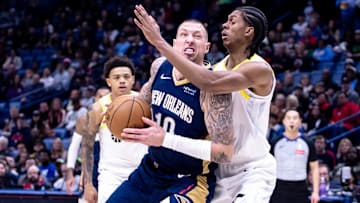 Jan 17, 2025; New Orleans, Louisiana, USA; New Orleans Pelicans center Daniel Theis (10) drives to the basket against Utah Jazz forward Cody Williams (5) during the first half at Smoothie King Center. Mandatory Credit: Stephen Lew-Imagn Images