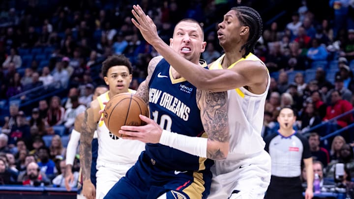 Jan 17, 2025; New Orleans, Louisiana, USA; New Orleans Pelicans center Daniel Theis (10) drives to the basket against Utah Jazz forward Cody Williams (5) during the first half at Smoothie King Center. Mandatory Credit: Stephen Lew-Imagn Images