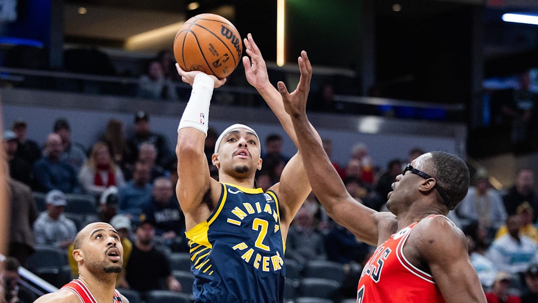 Jan 8, 2025; Indianapolis, Indiana, USA; Indiana Pacers guard Andrew Nembhard (2) shoots the ball while Chicago Bulls forward Jalen Smith (7) defends in the second half at Gainbridge Fieldhouse. Mandatory Credit: Trevor Ruszkowski-Imagn Images
