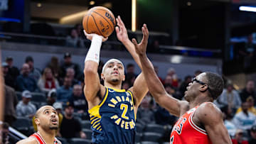 Jan 8, 2025; Indianapolis, Indiana, USA; Indiana Pacers guard Andrew Nembhard (2) shoots the ball while Chicago Bulls forward Jalen Smith (7) defends in the second half at Gainbridge Fieldhouse. Mandatory Credit: Trevor Ruszkowski-Imagn Images