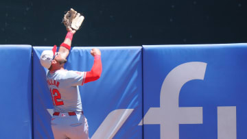 Jul 4, 2024; Oakland, California, USA; Los Angeles Angels center fielder Kevin Pillar (12) catches the ball above the outfield wall during the first inning against the Oakland Athletics at Oakland-Alameda County Coliseum. Mandatory Credit: Kelley L Cox-USA TODAY Sports