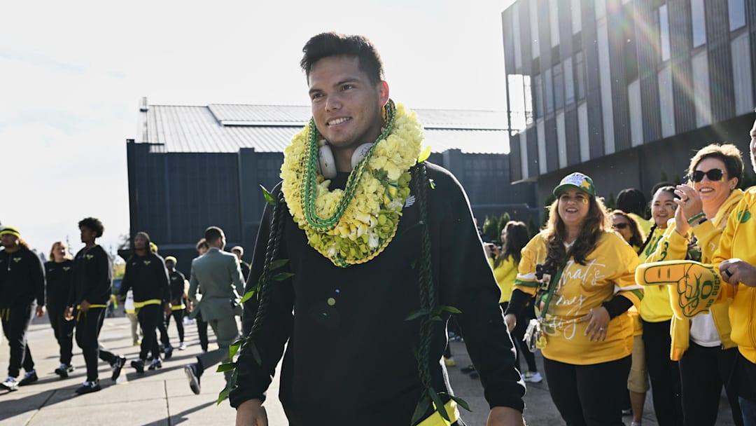 Oct 4, 2024; Eugene, Oregon, USA; Oregon Ducks quarterback Dillon Gabriel (8) visits with family and fans before a game against the Michigan State Spartans at Autzen Stadium. Mandatory Credit: Troy Wayrynen-Imagn Images
