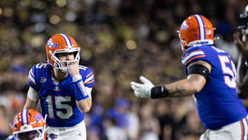 Oct 5, 2024; Gainesville, Florida, USA; Florida Gators quarterback Graham Mertz (15) calls a play to Florida Gators offensive lineman Austin Barber (58) during the first half at Ben Hill Griffin Stadium. Mandatory Credit: Matt Pendleton-Imagn Images
