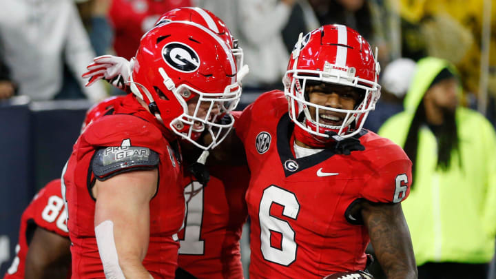 Georgia wide receiver Dominic Lovett (6) celebrate with his teammates after scoring a touchdown during the first half of a NCAA college football game against Georgia Tech in Atlanta, on Saturday, Nov. 25, 2023.