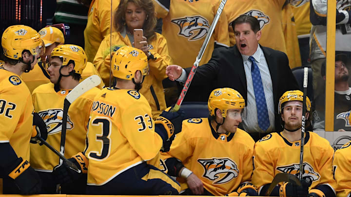 Mar 27, 2018; Nashville, TN, USA; Nashville Predators head coach Peter Laviolette sets his lineup as overtime resumes after a goal was overturned for an offsides call against the Minnesota Wild at Bridgestone Arena. Mandatory Credit: Christopher Hanewinckel-Imagn Images