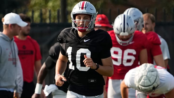 Aug 8, 2024; Columbus, Ohio, USA; Ohio State Buckeyes quarterback Julian Sayin (10) runs during football practice at the Woody Hayes Athletic Complex.