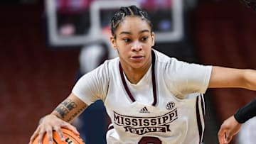 Mississippi State guard Jerkaila Jordan (2) moves the ball past Texas A & M guard Tineya Hylton (3) during the third quarter of the SEC Women's Basketball Tournament game three at the Bon Secours Wellness Arena in Greenville, S.C. Thursday, March 7, 2024.